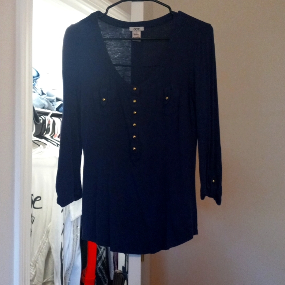 Blue shirt with gold buttons